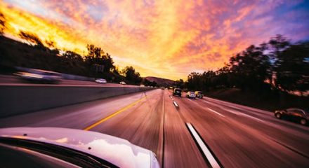 pexels-photo-593172-593172 Motion blur of cars speeding on an Irvine highway at sunset with vibrant skies.